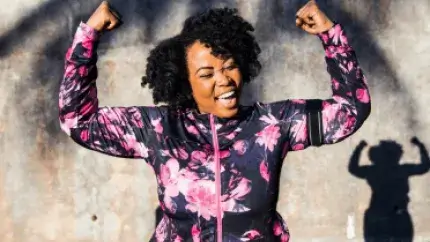 Women flexing and smiling