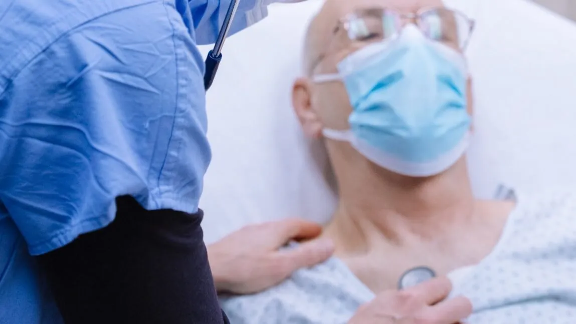 clinician with patient in hospital