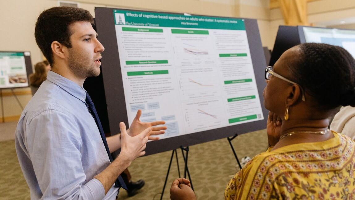 A student describes his research at the Zeigler Forum.