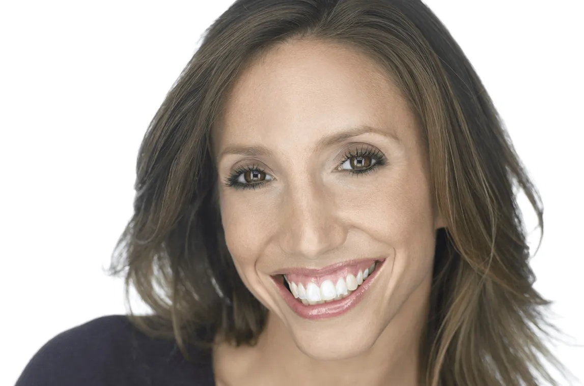 Andrea Maas, smiling broadly in portrait 