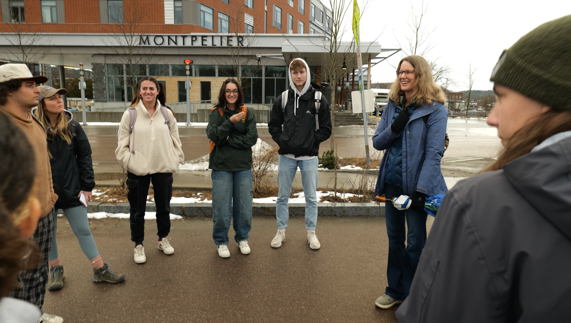 students with faculty evaluating flood site