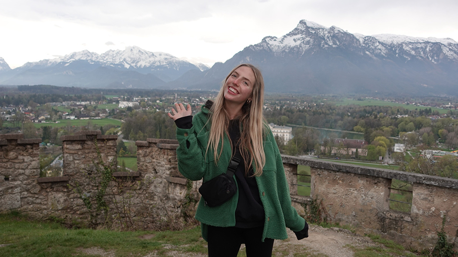 Meghan in an outdoor setting with snowcapped mountains in the background