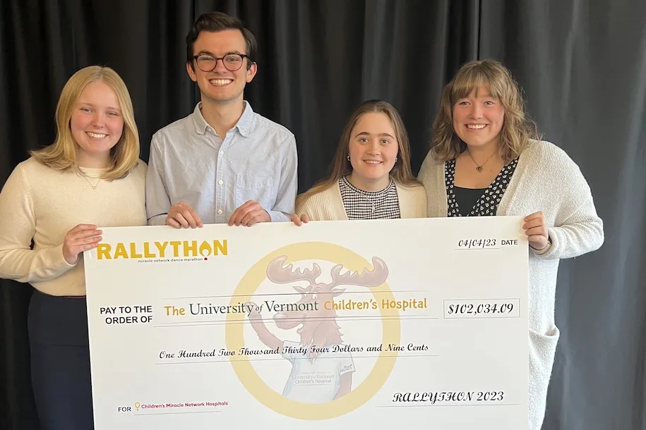 RALLYTHON board members hold up the check for over $102,000 to the UVM Children's Hospital. 