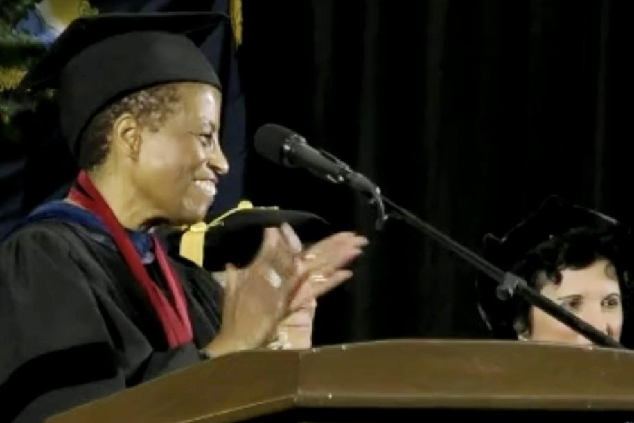 Dean Noma Anderson claps for Class of 2023