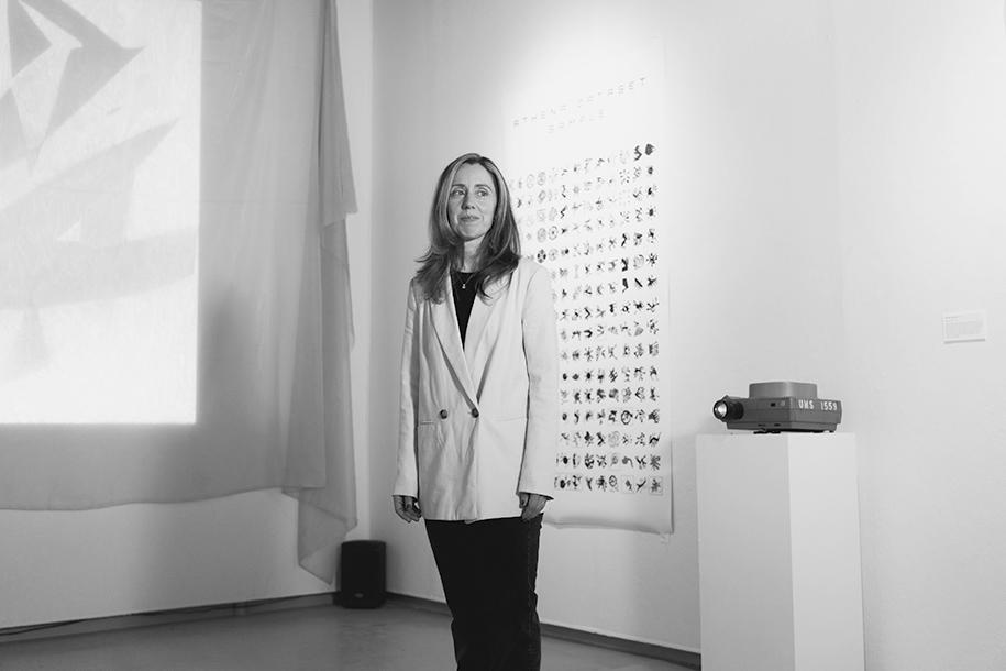 Jenn Karson standing in an art gallery