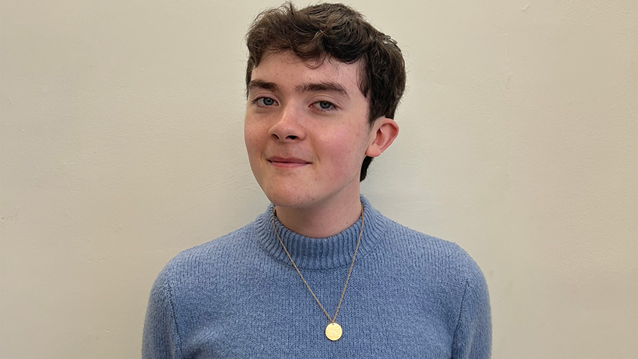 Portrait of Cole Barry with a whimsical smile