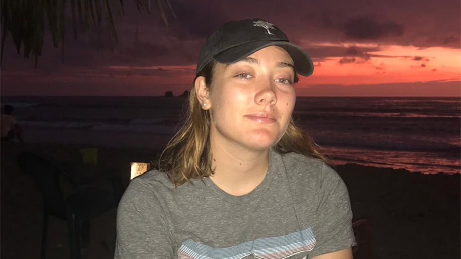 Eliza by a lake at sunset