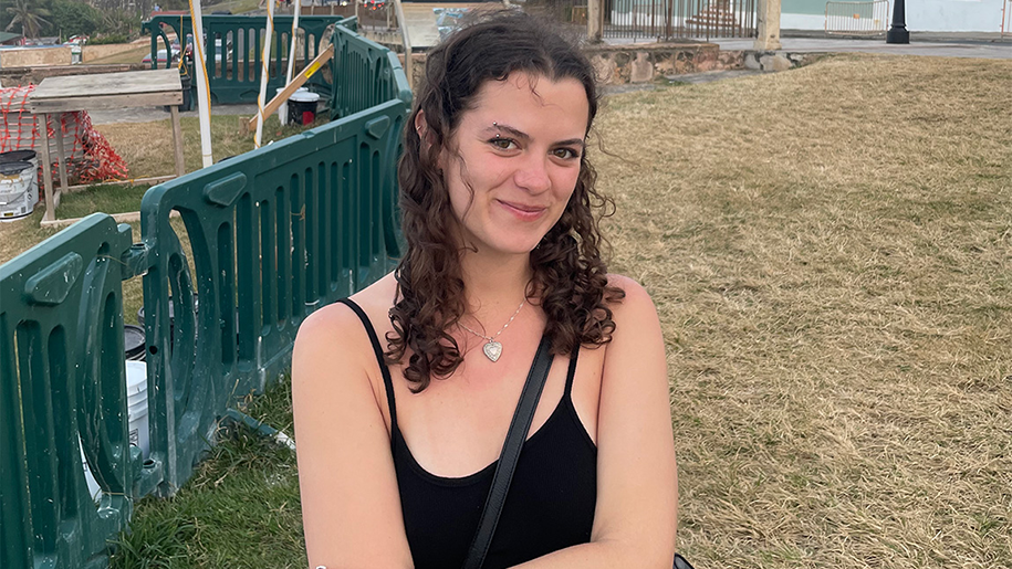 Olivia smiling for the camera in an outdoor setting