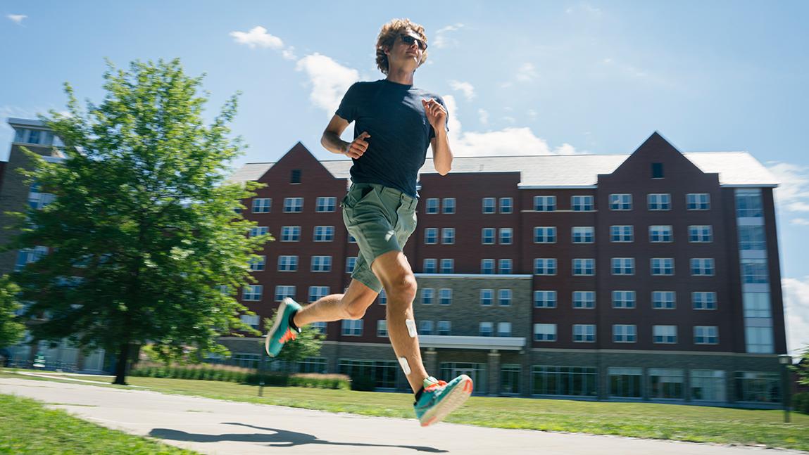 person wearing sensor and running