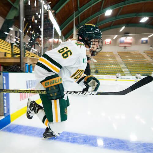 A hockey player heads out onto the ice.