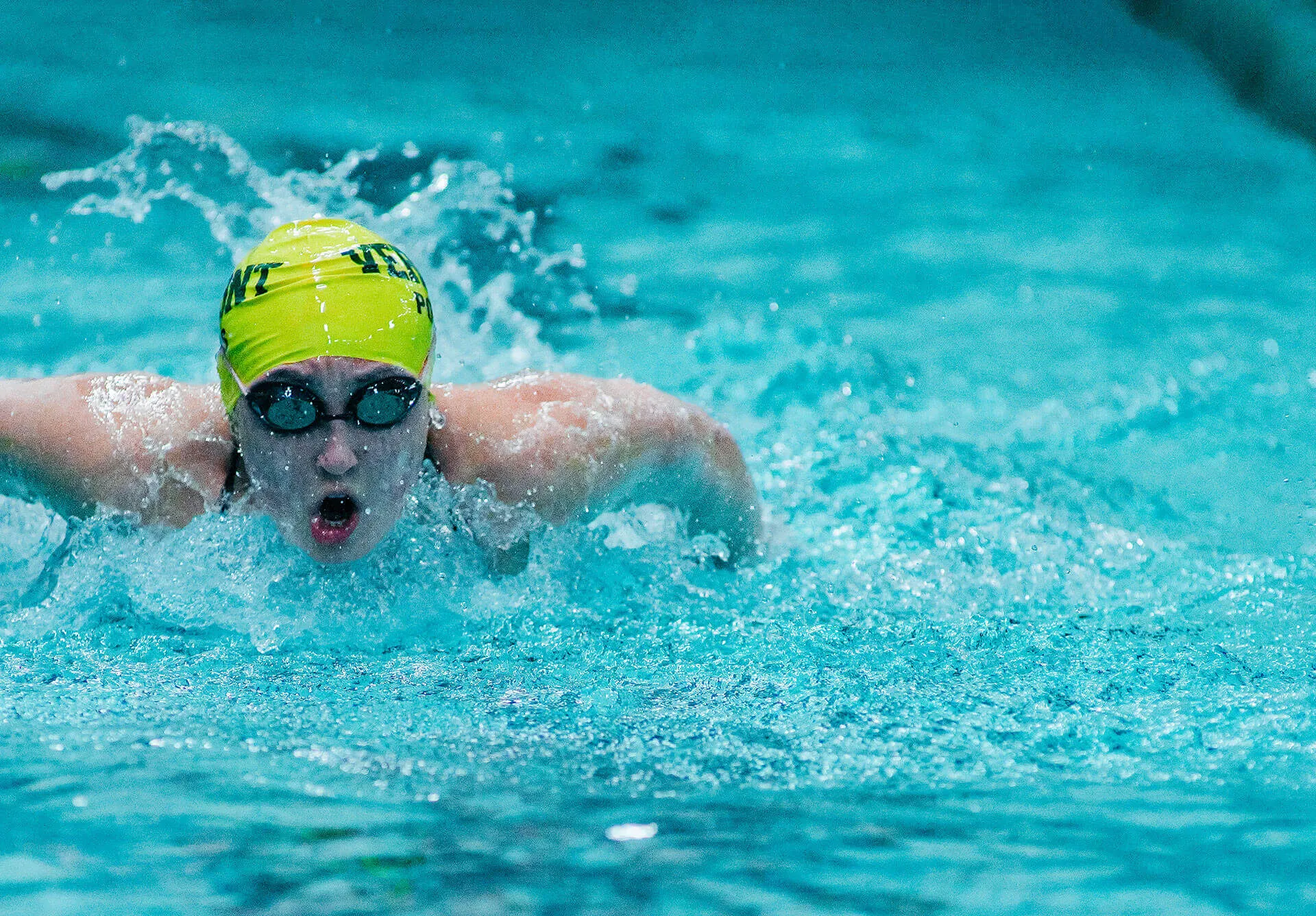 Swimmer takes a lap.