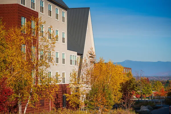 Exterior view of University Heights building with mountains in the background