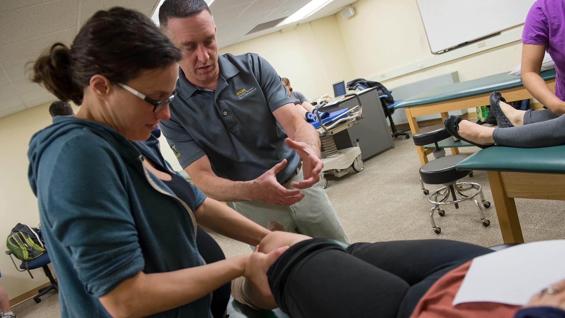 Manipulating the knee articulation during a class in the College of Nursing and Health Sciences