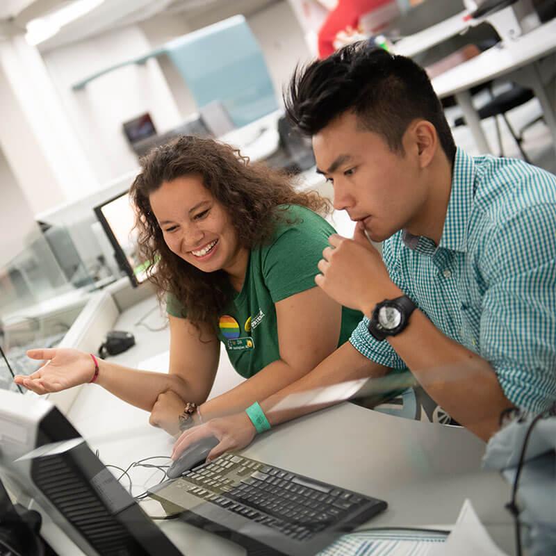 two students at a computer workstation