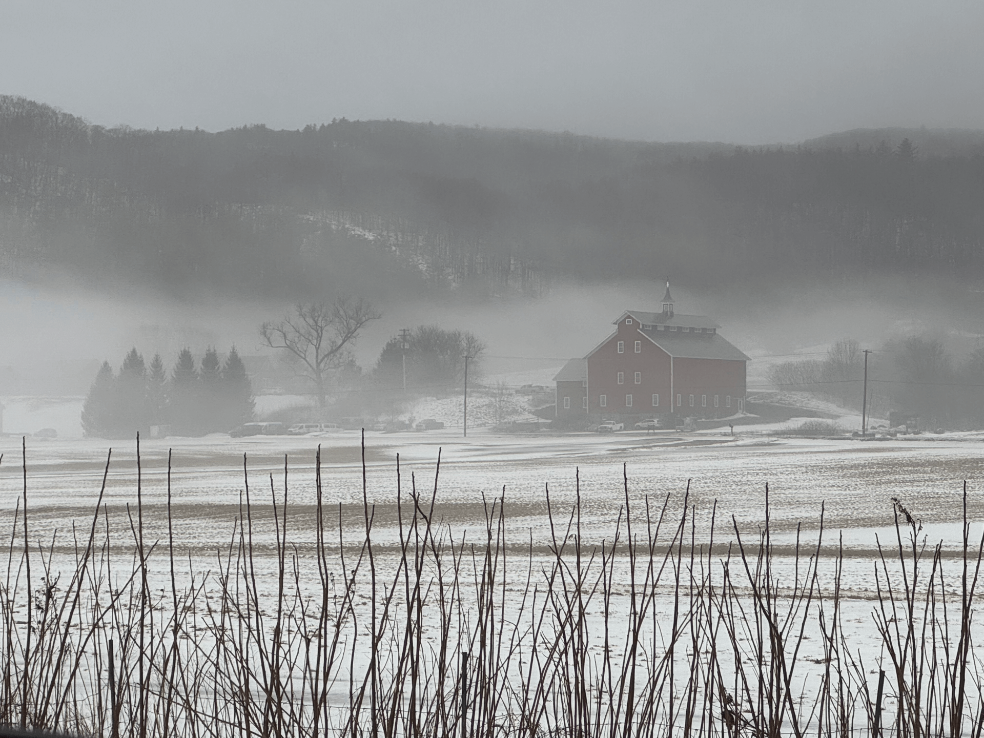 Historic barn in a field covered with snow