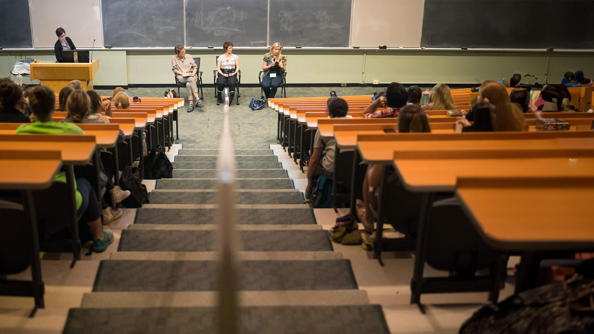 an isle of a large lecture hall 