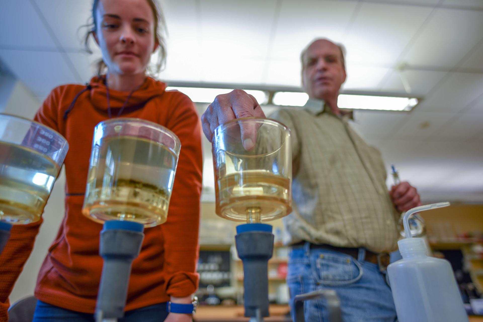 Student and Faculty doing an experiment in the lab