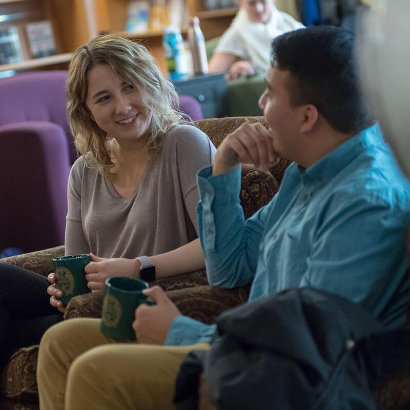 two nursing students talking in a coffee shop