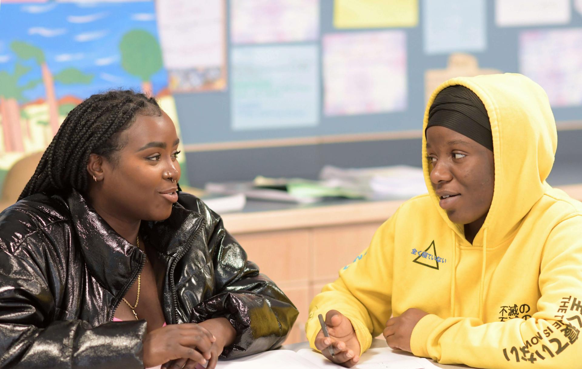 Franky Bahati mentoring a student at Winooski Middle School.