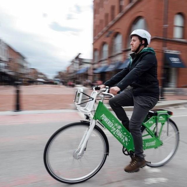 Student riding bike