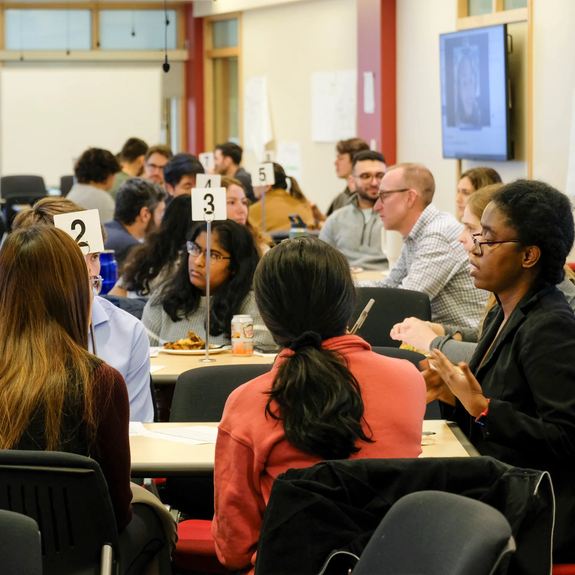 Mentors and mentees conversing