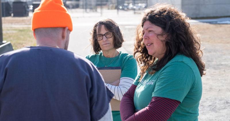 Justice Research Initiative researchers meet with an inmate 