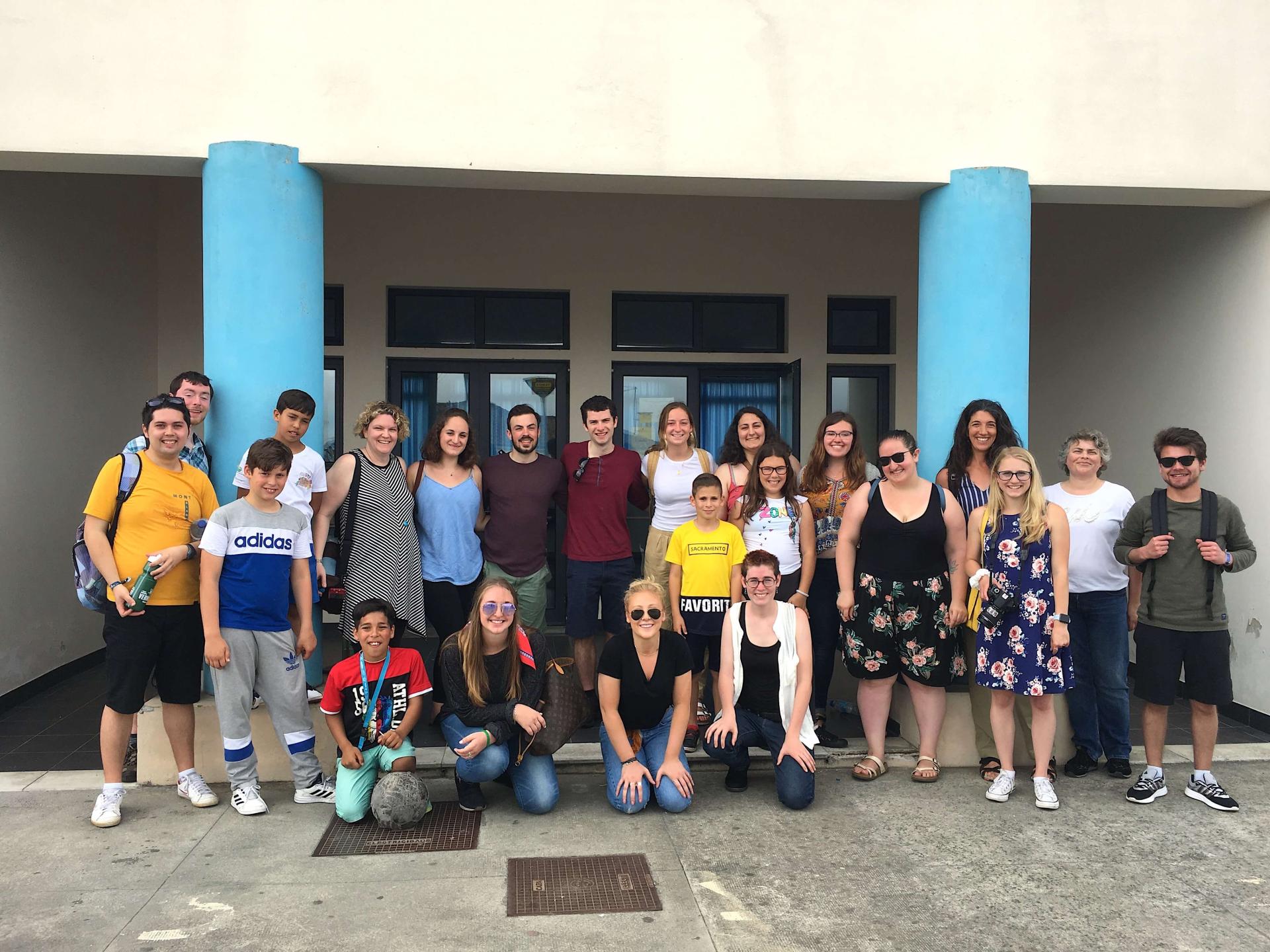 UVM students and faculty gathered with a group of school children at a school in the Azores Islands of Portugal.