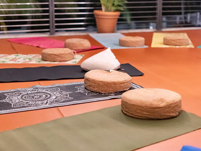 pads and mats laid out on a wooden deck