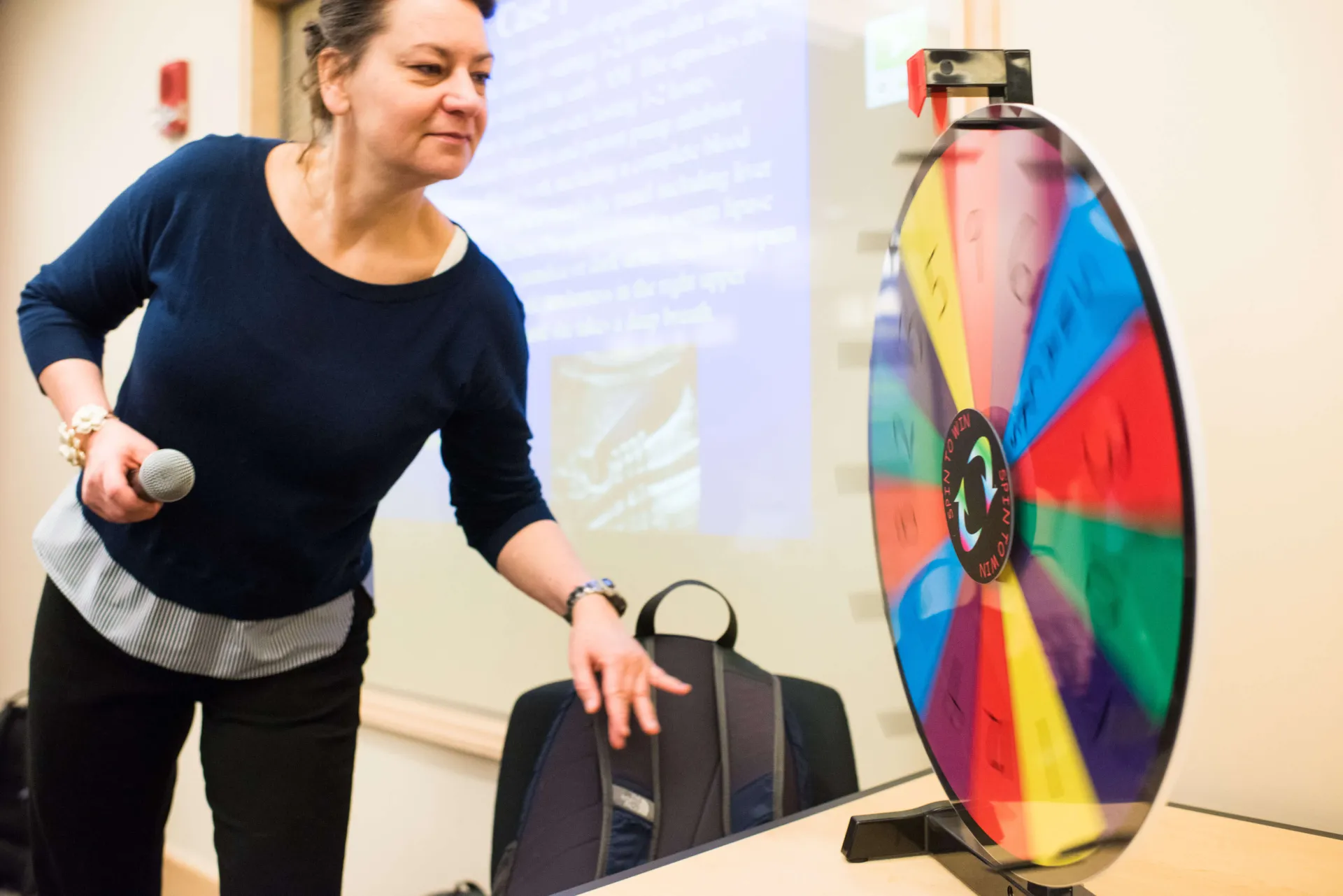 Student spinning wheel in Active Learning classroom. 