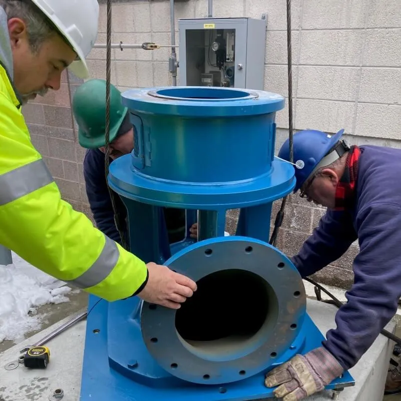 engineer installing a large pump