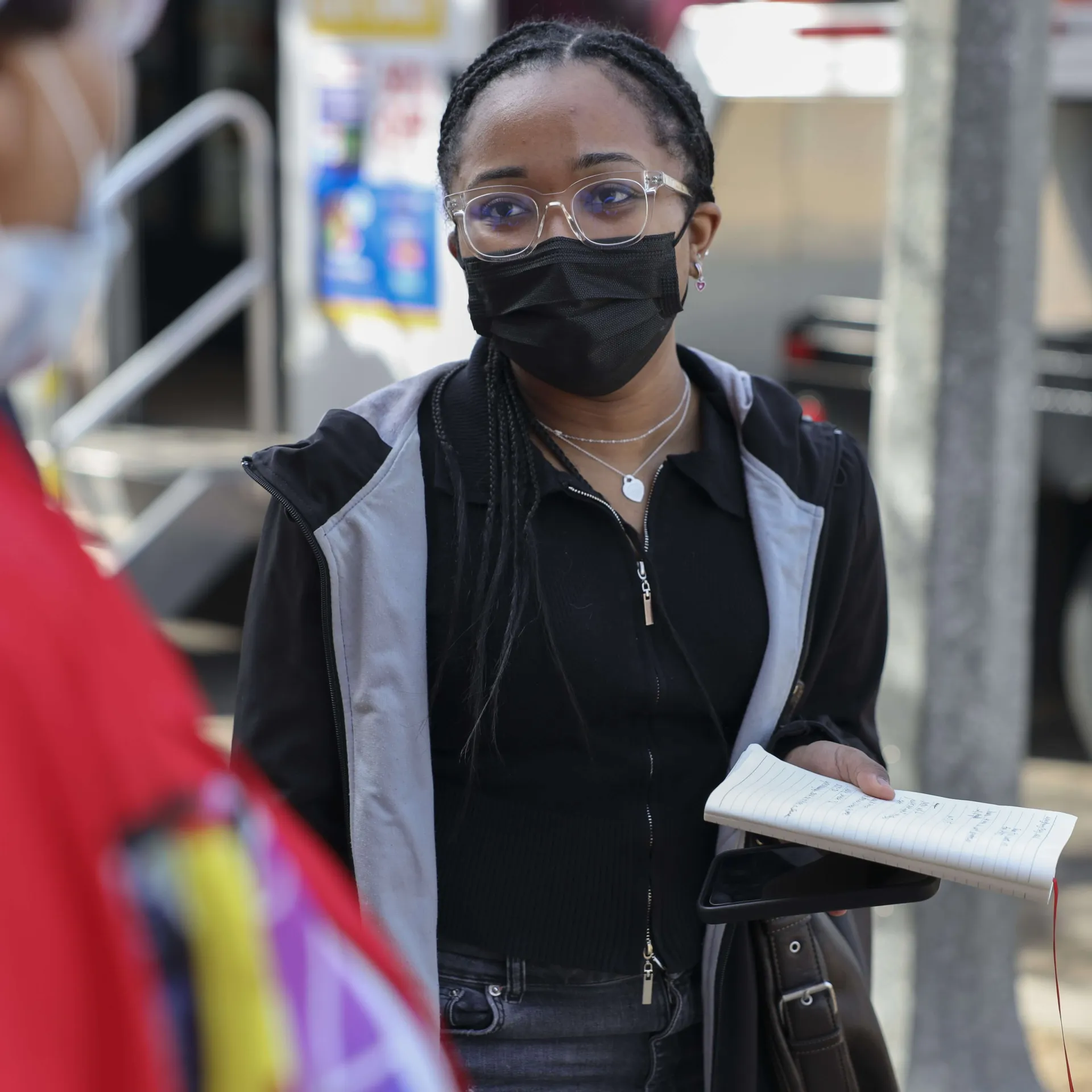 A student reporter conducts an interview out in the field.
