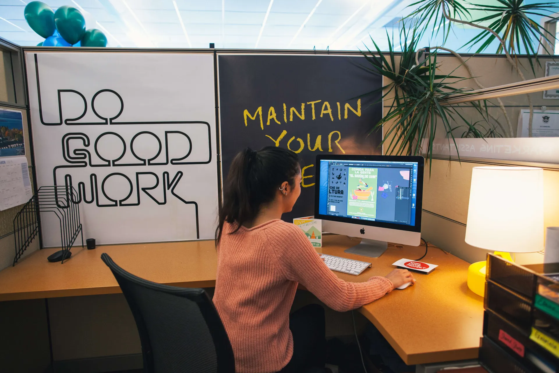 A Student Life worker uses Adobe Illustrator to respond to a marketing form request.