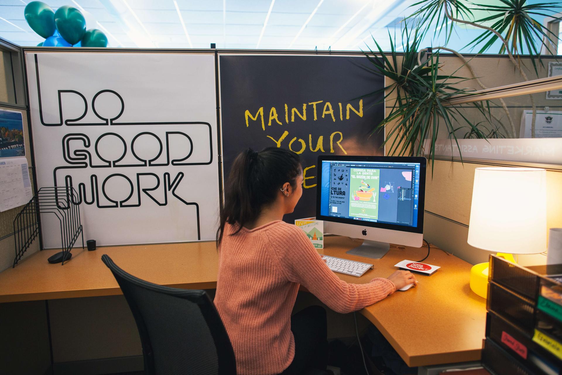 A Student Life worker uses Adobe Illustrator to respond to a marketing form request.