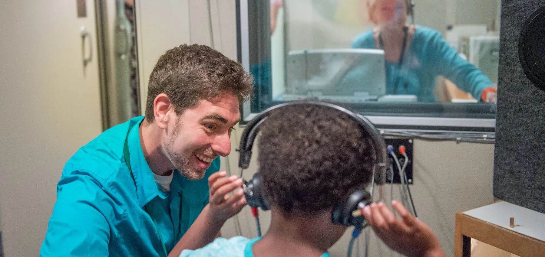 Student working with young client in the clinic