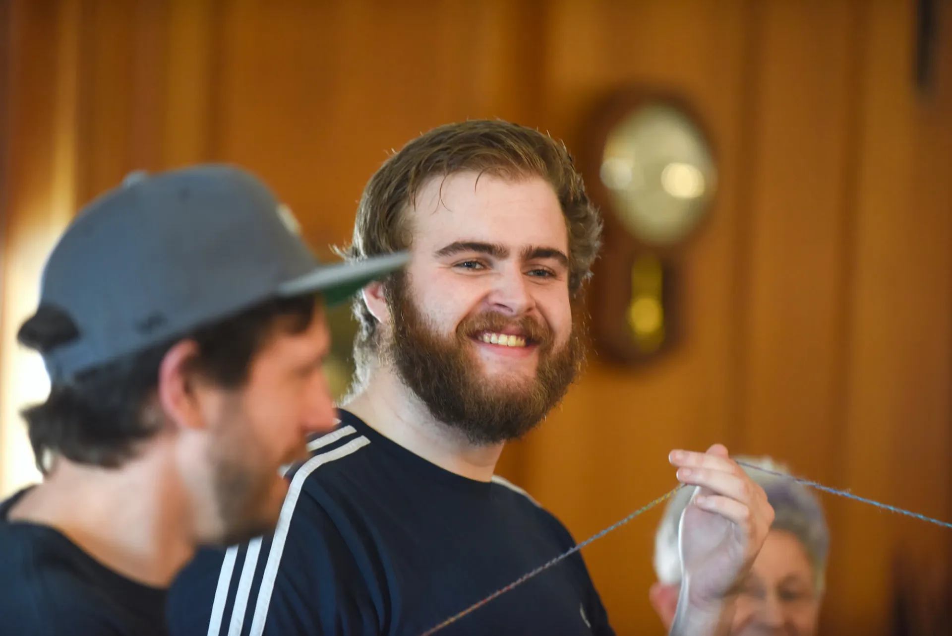 Student smiles during a group activity with his social work (BSW) cohort.