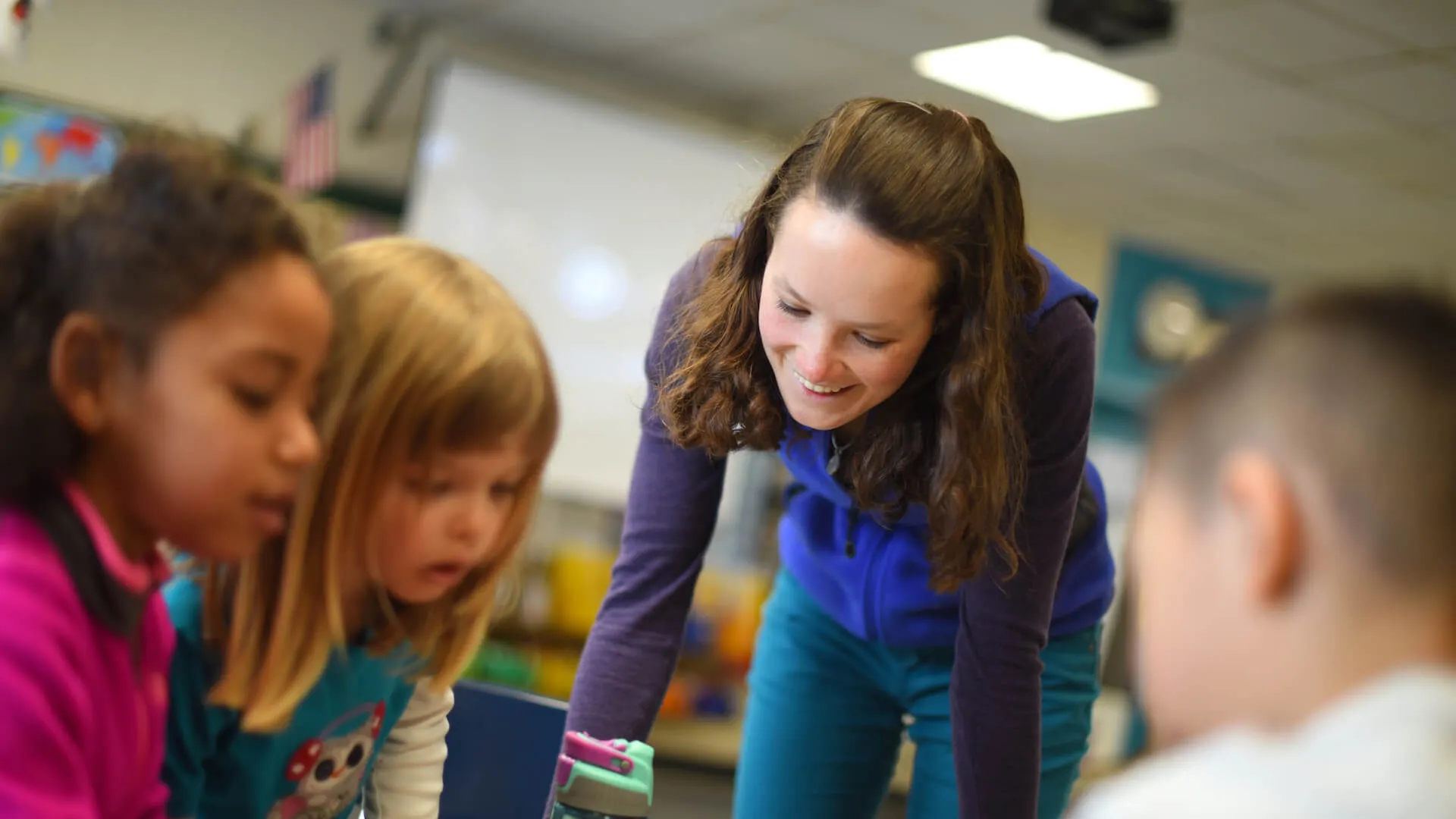 Student teacher working with children at Champlain Elementary School.