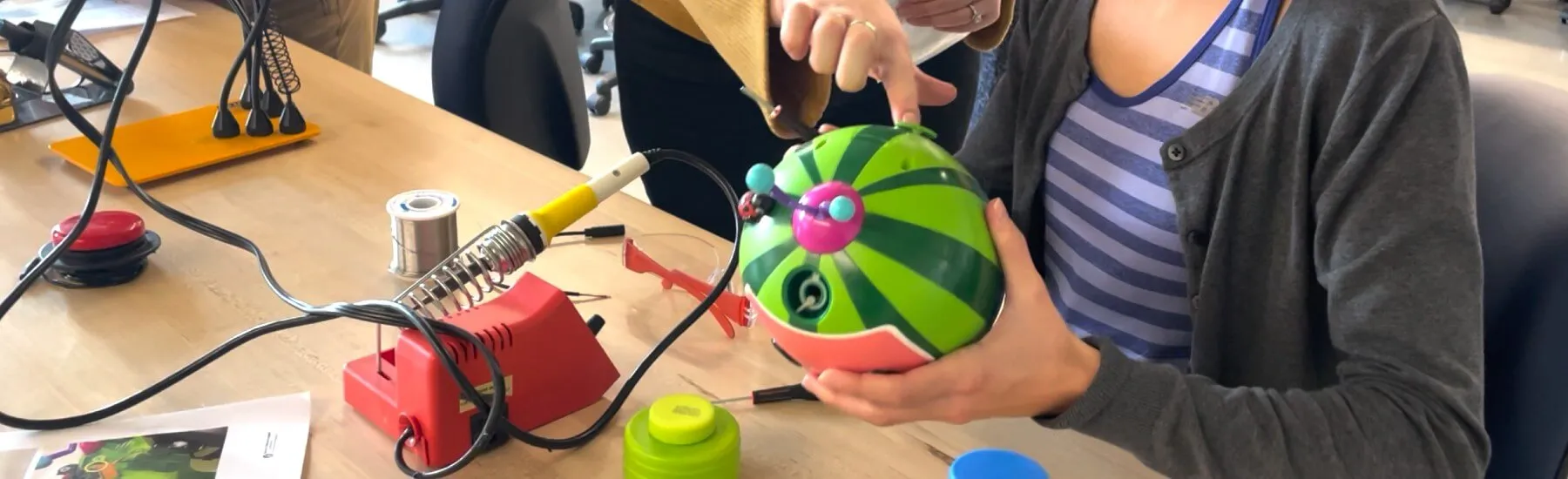 UVM occupational therapy student adapts a toy in the lab for a young client