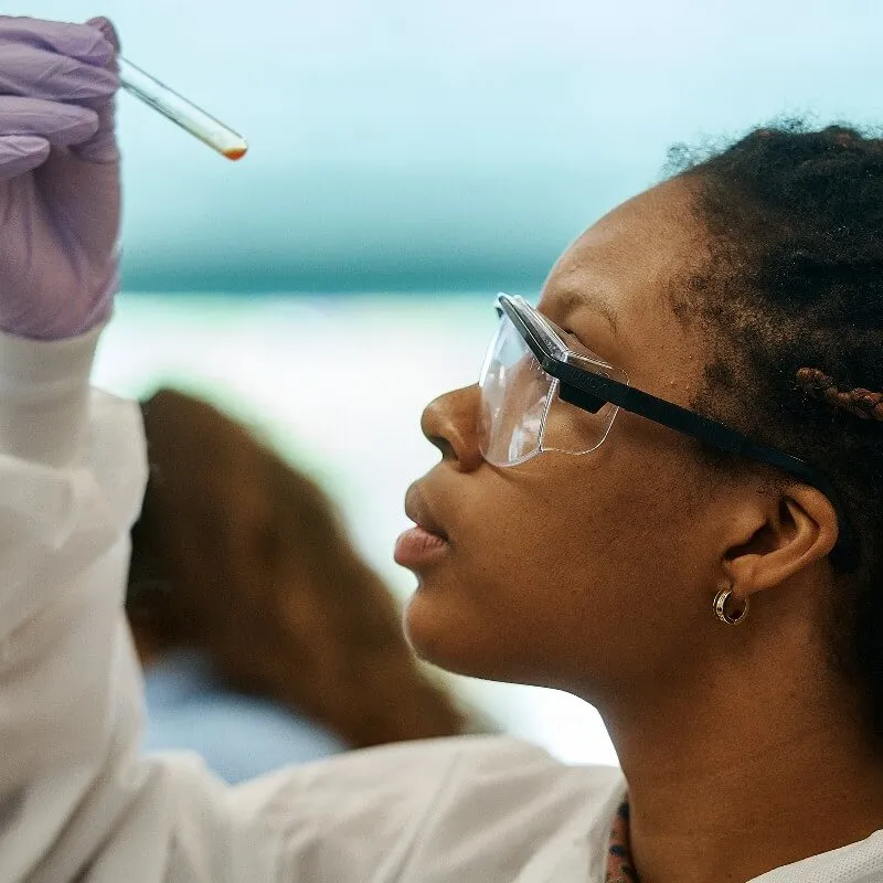 Student holding test tube