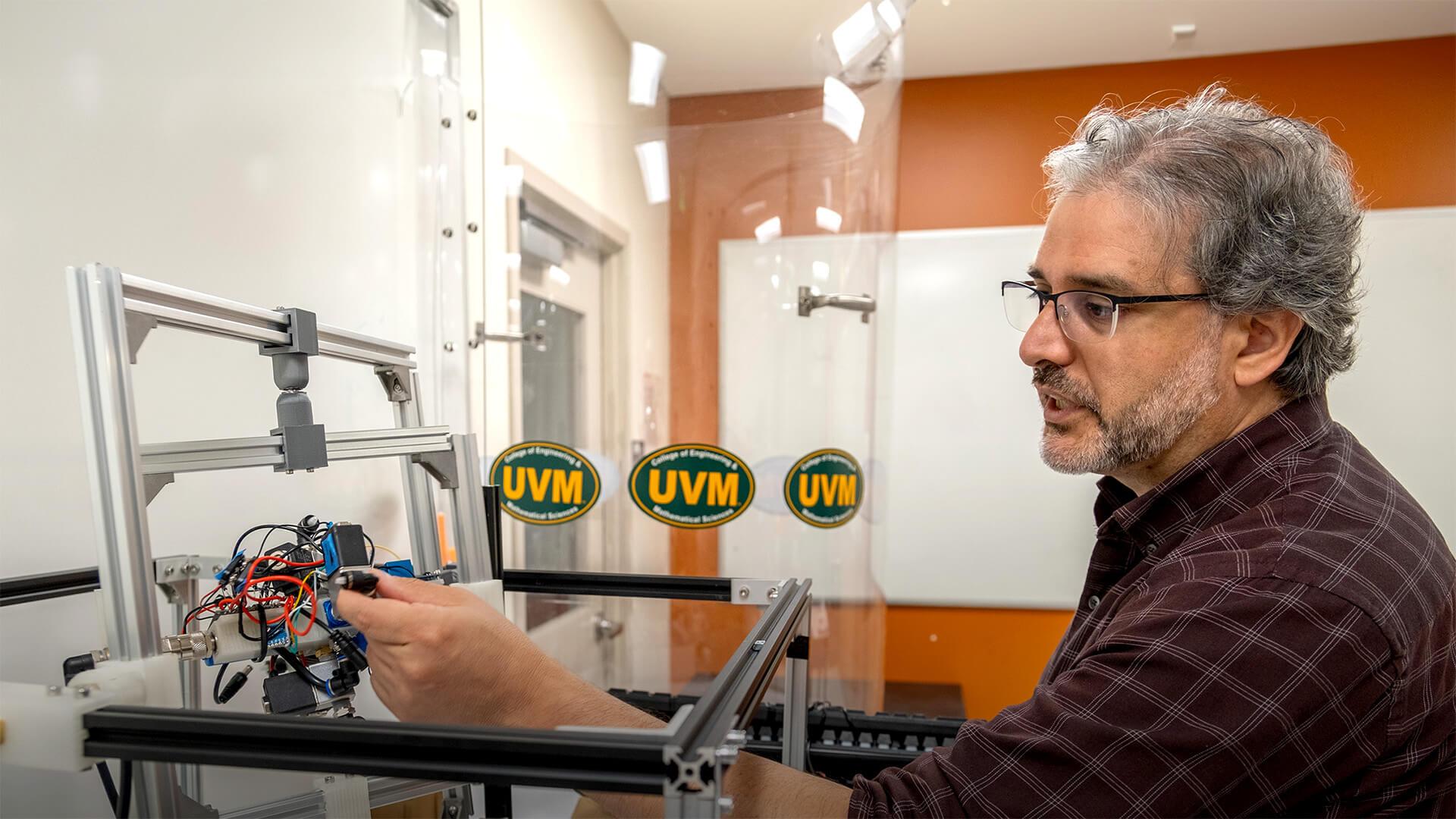 Professor Luis Duffault works in his autonomous technology lab