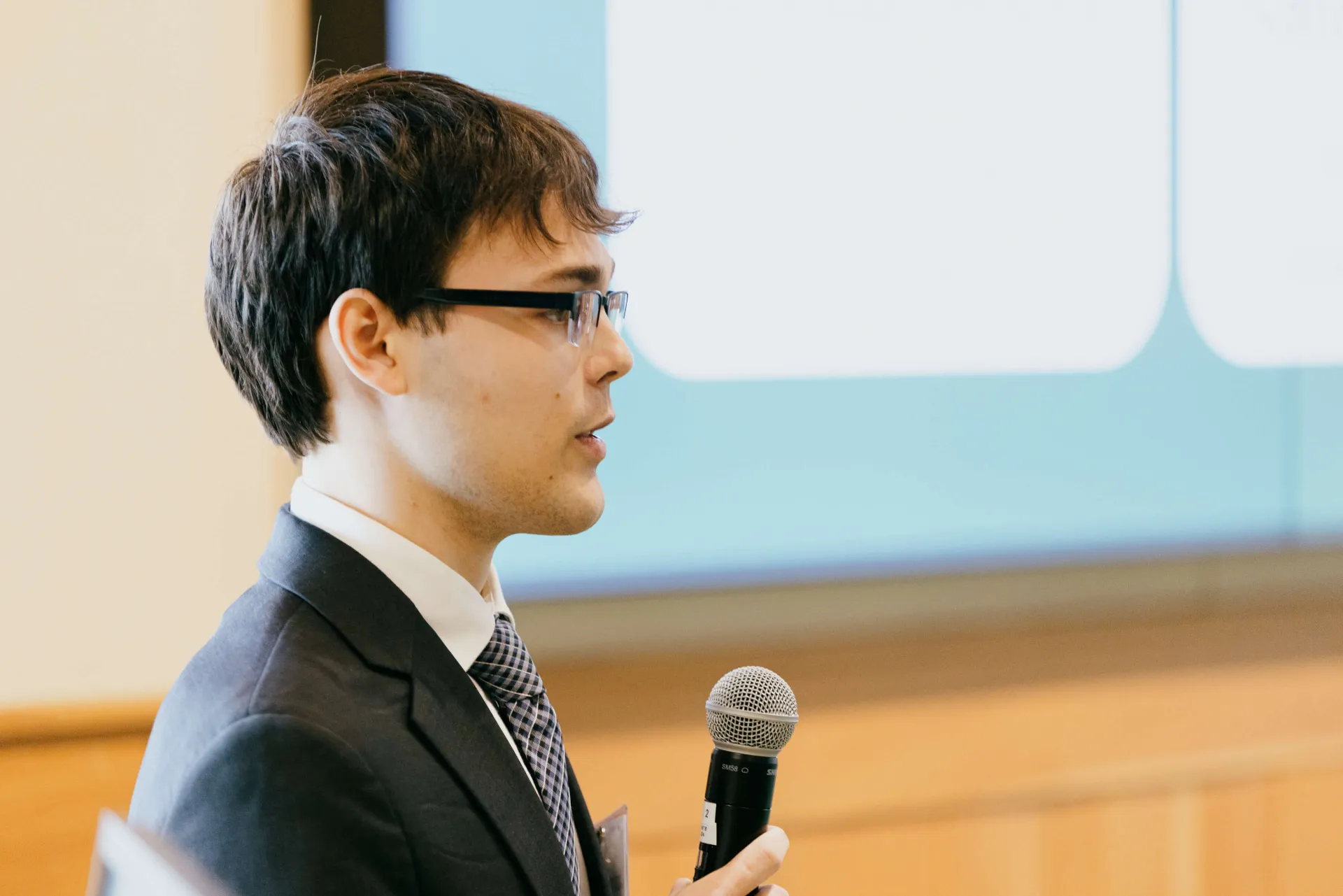 man speaking into a microphone