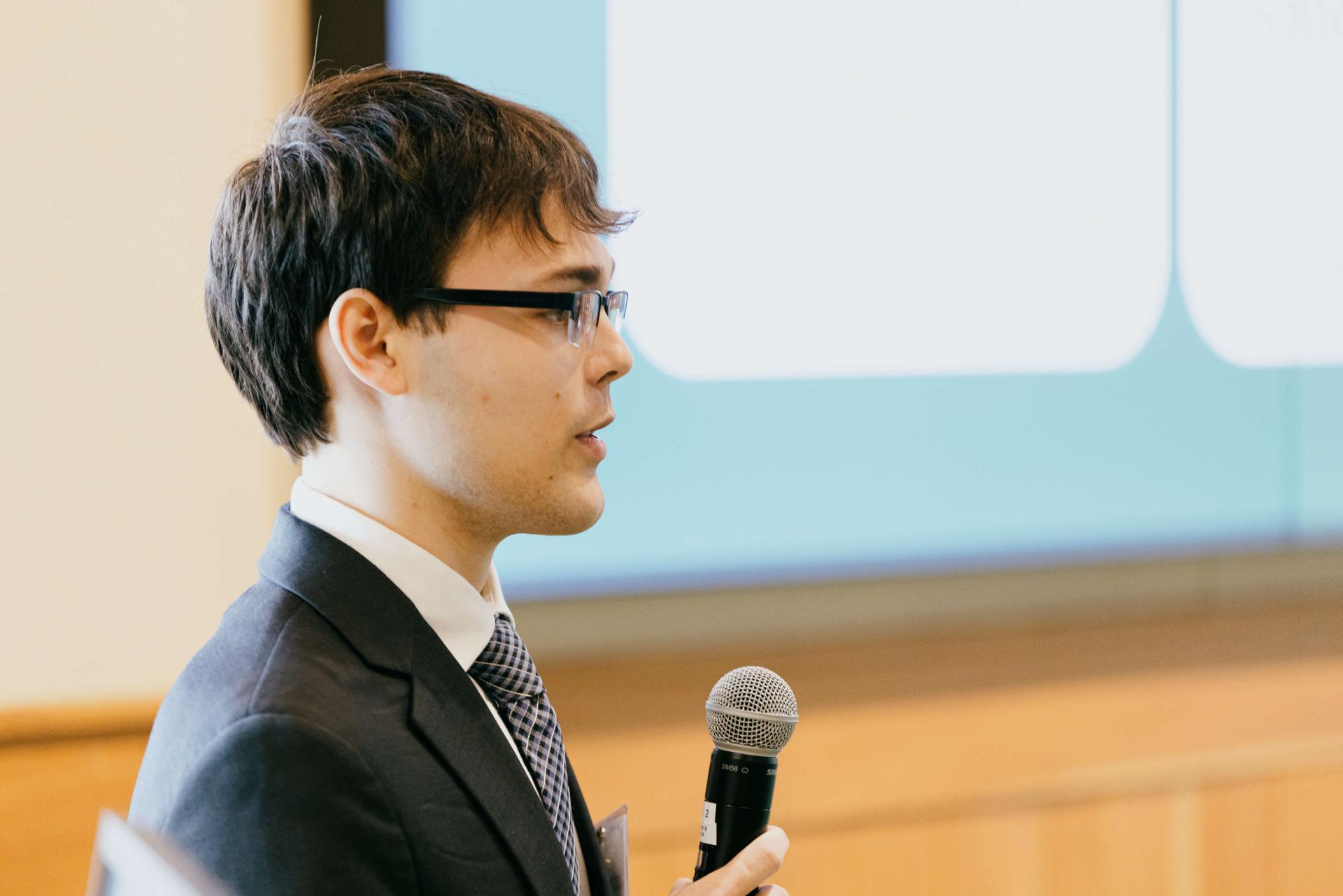 man speaking into a microphone
