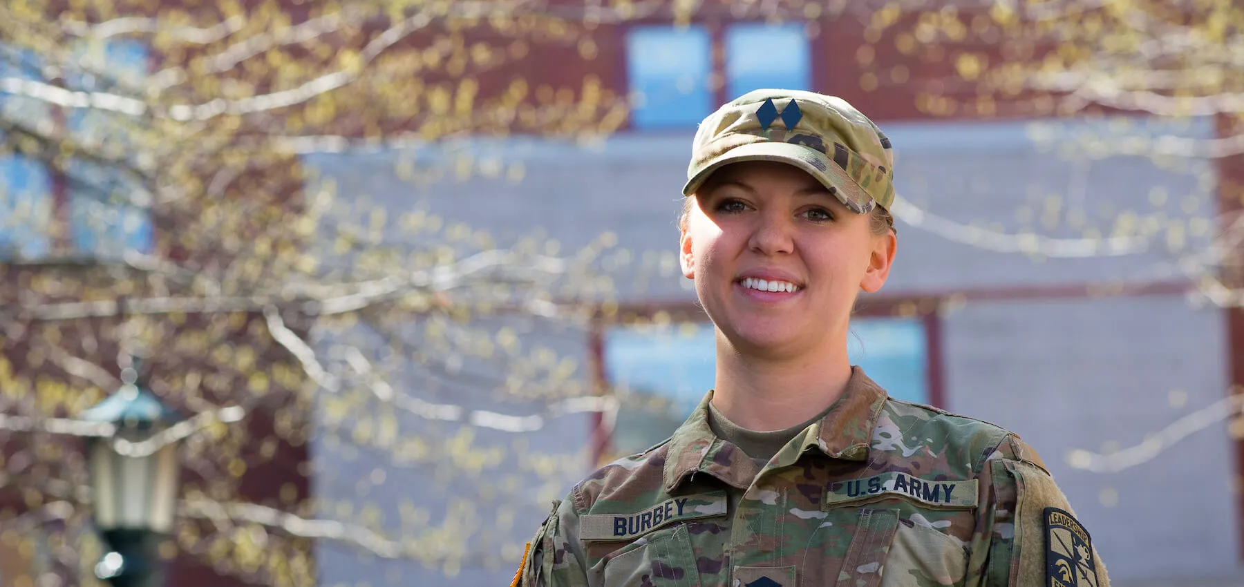 ROTC student smiling outdoors on campus