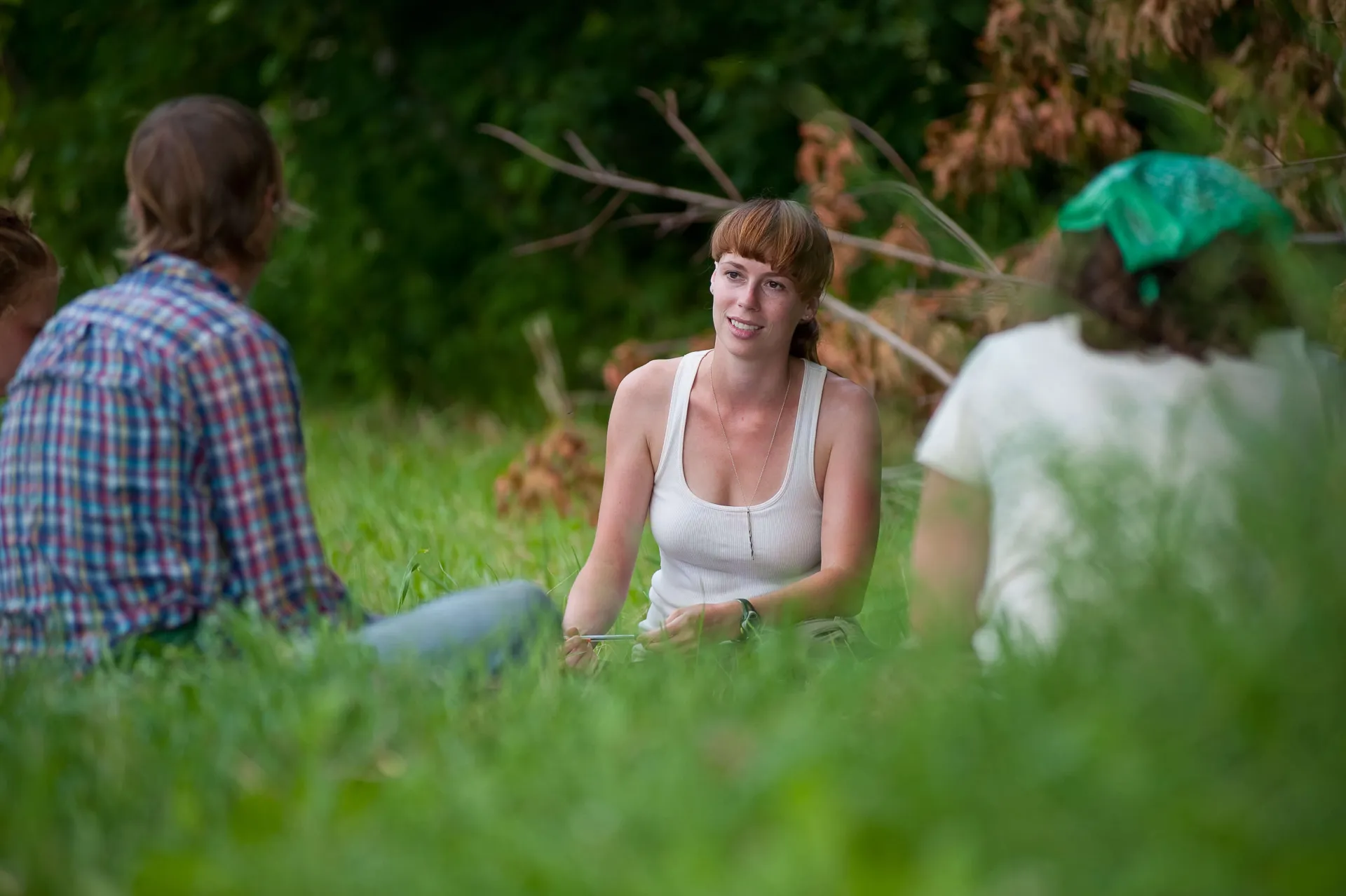 Students sitting in a field