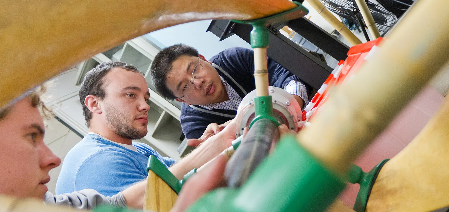 Professor and students work together on a wind turbine project