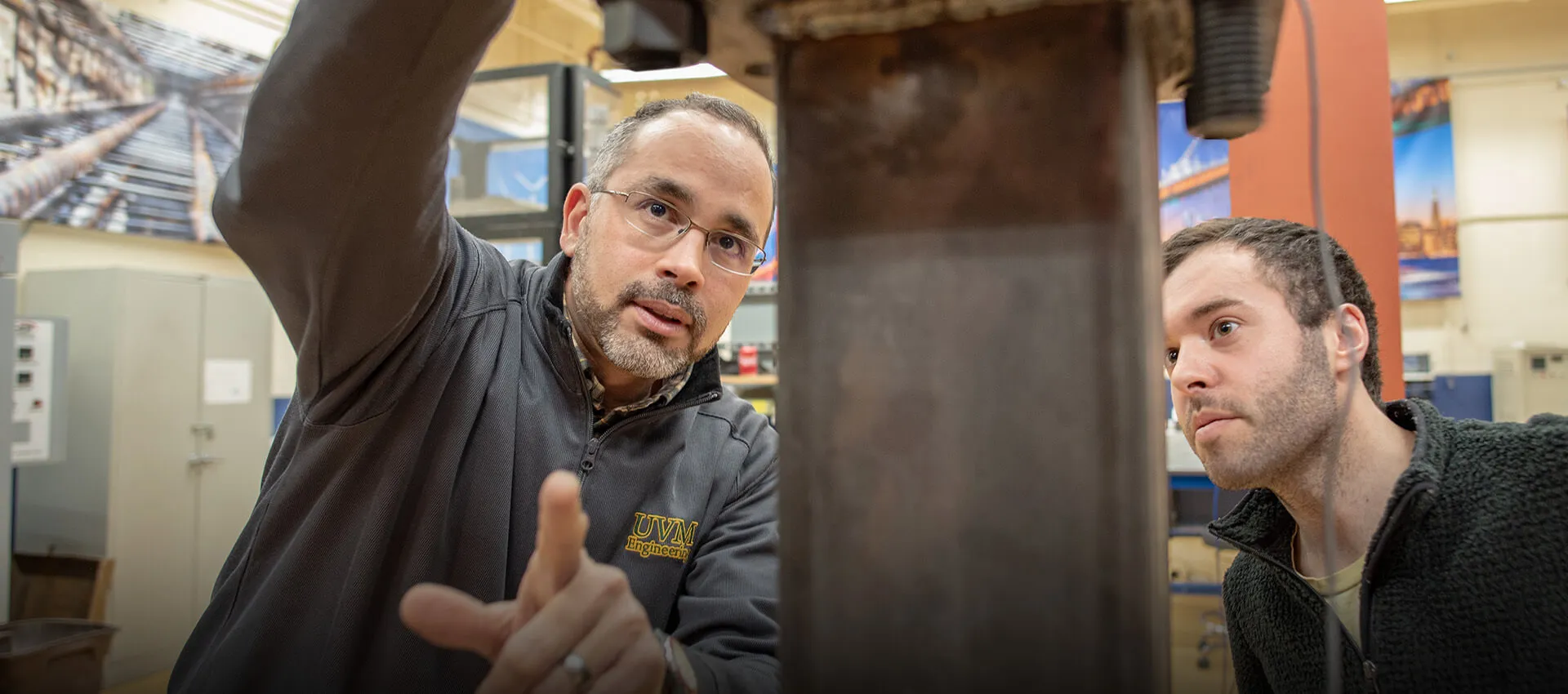 Civil Engineering professor Eric Hernandez shares equipment in the materials lab with a student