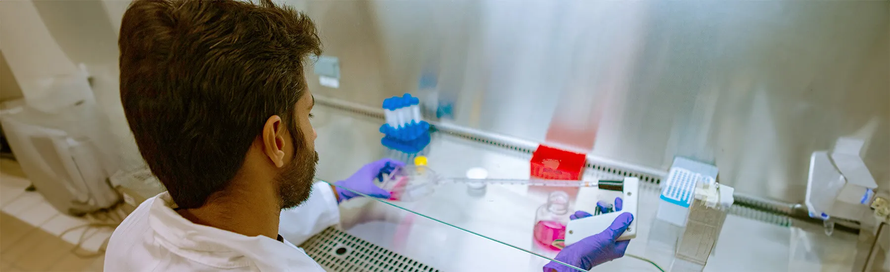ME graduate student at work in a lab