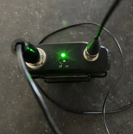 Close-up picture of a micpack showing cable connections and on/off switch