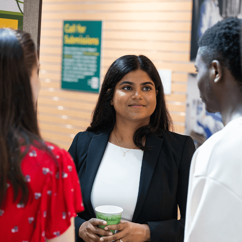 Three students at the summer student research fair.