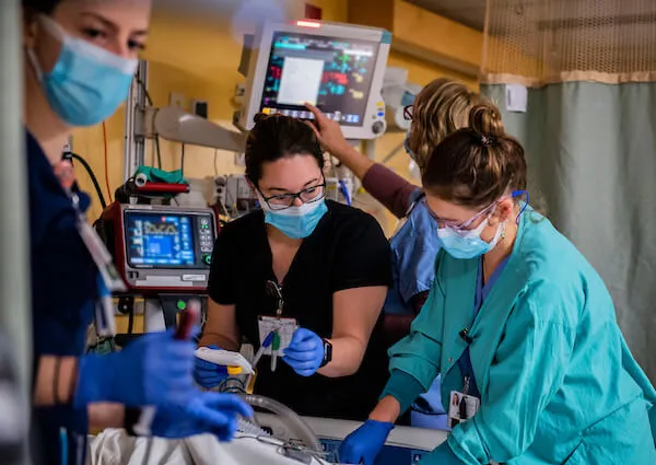 three people in clinical setting