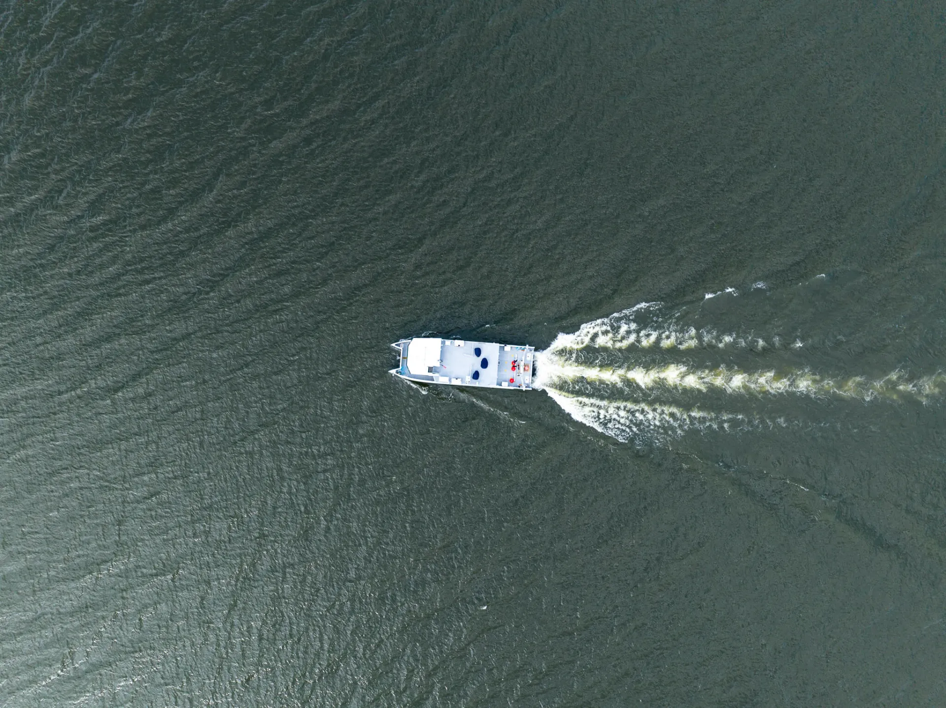 An aerial view of a boat on water